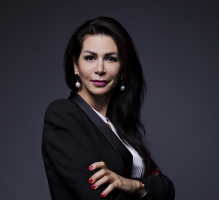 Maye Elqasem in a black blazer and white shirt professional photo