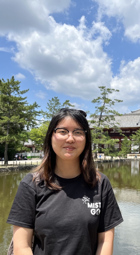 Headshot of Vicky Li with Tōdai-ji Temple and Kagamike Pond in the background