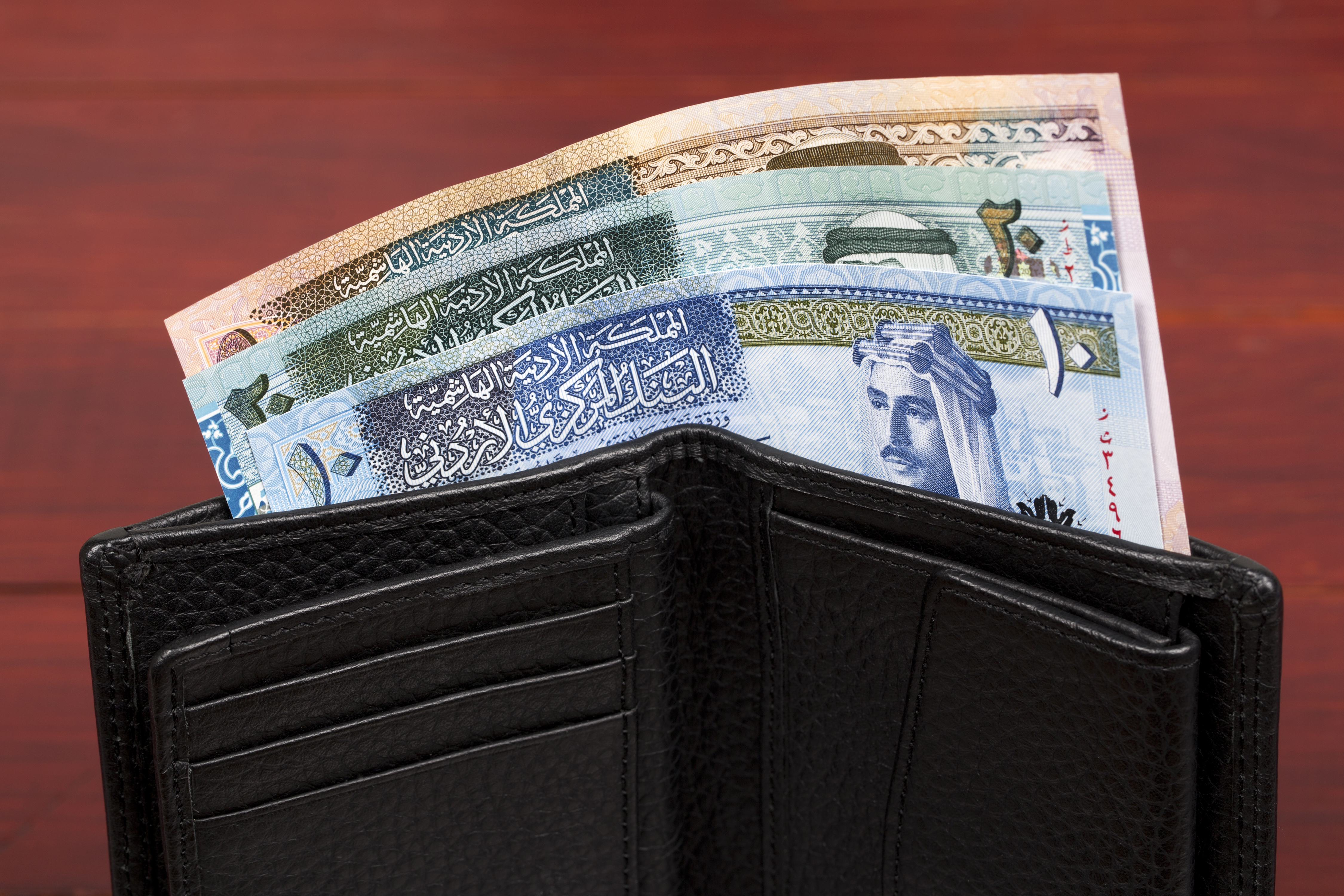 Jordanian dinar money in black wallet