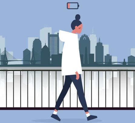 Illustration of person walking along the riverside with the city skyline in the background. The person is slouching, looking drained, and there is a low-battery icon hovering over their head