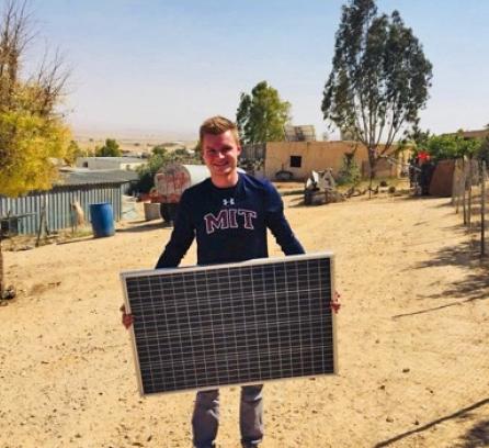 Lukas in Gaza with solar panel