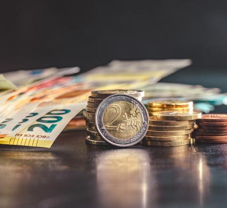 Pile of Euro paper notes and coins