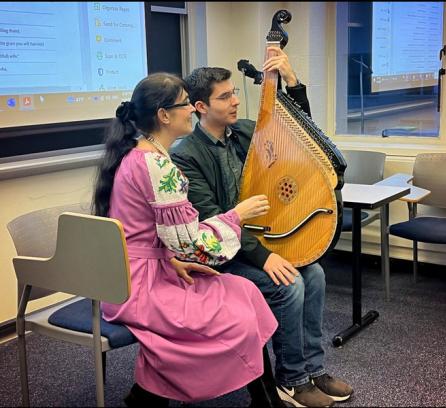 Olena Tsar (left), Ukrainian singer and bandura player, teaches a student a simple melody. Photo: Alison Lanier, MIT News