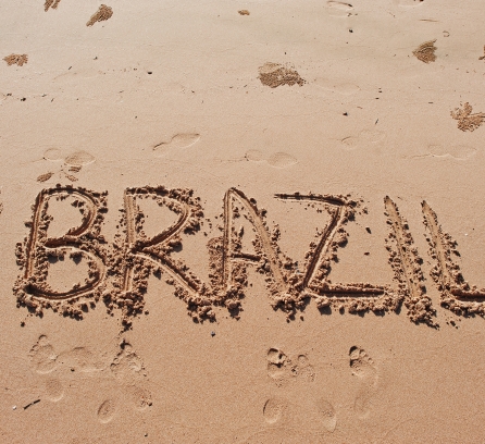 "Brazil" written in the sand on the beach