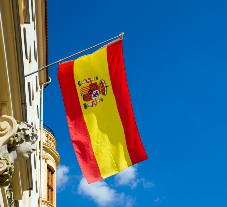 Spain flag flying on old building