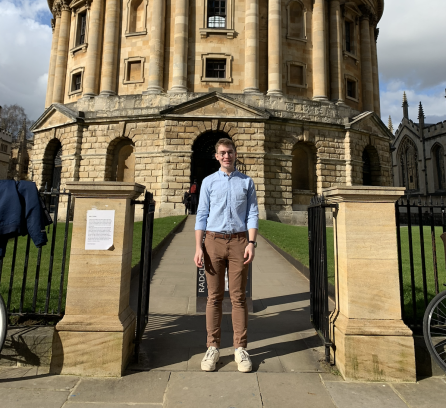 Richard Colwell in front of a rotunda with pale blue roof in Oxford, UK