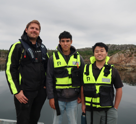 Beckett stands with his supervisor and fellow intern