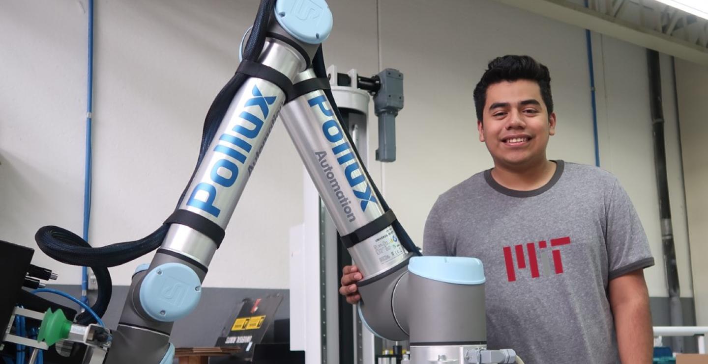 Robotics and Student in MIT Shirt