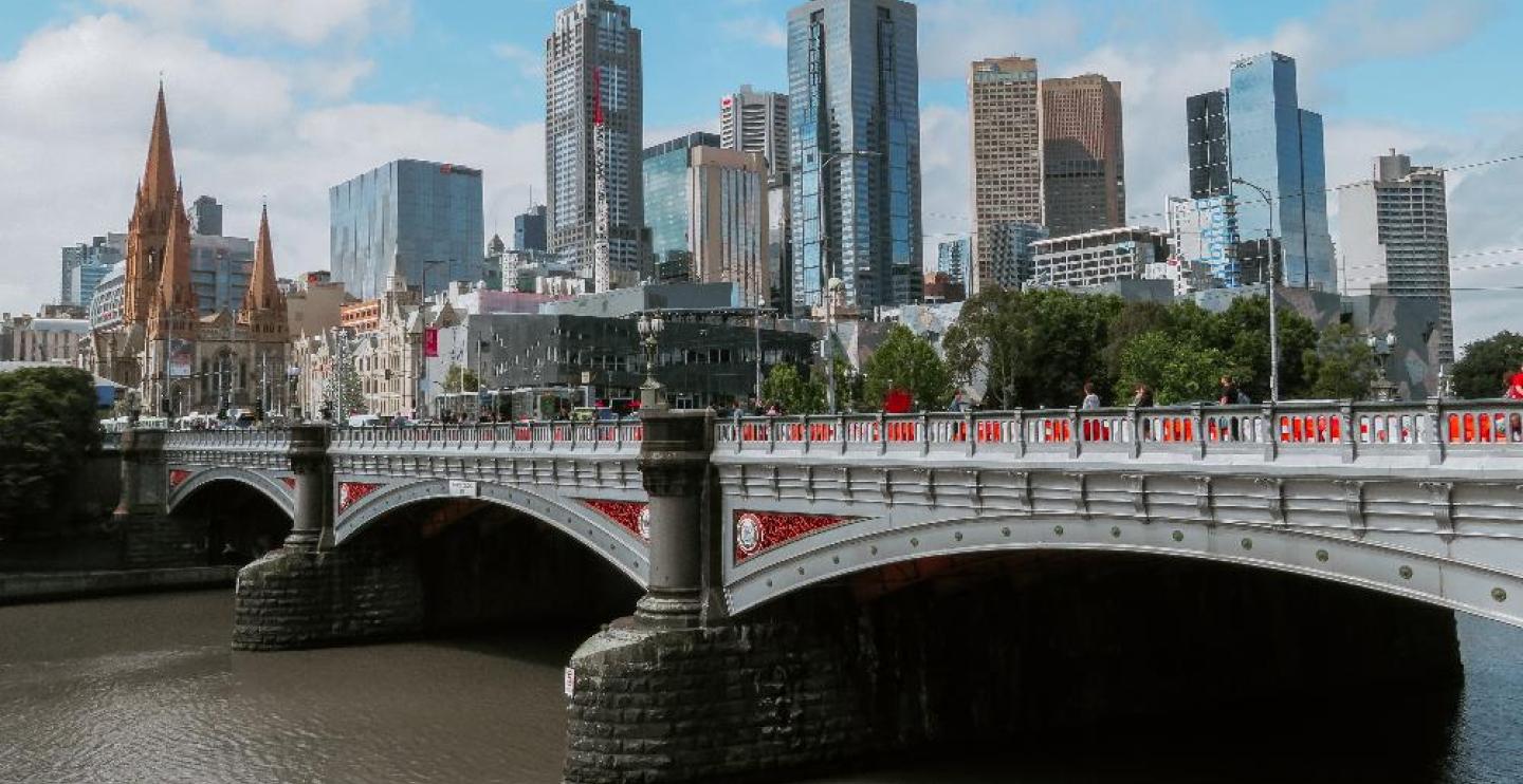 Image of Melbourne with a bridge in the foreground