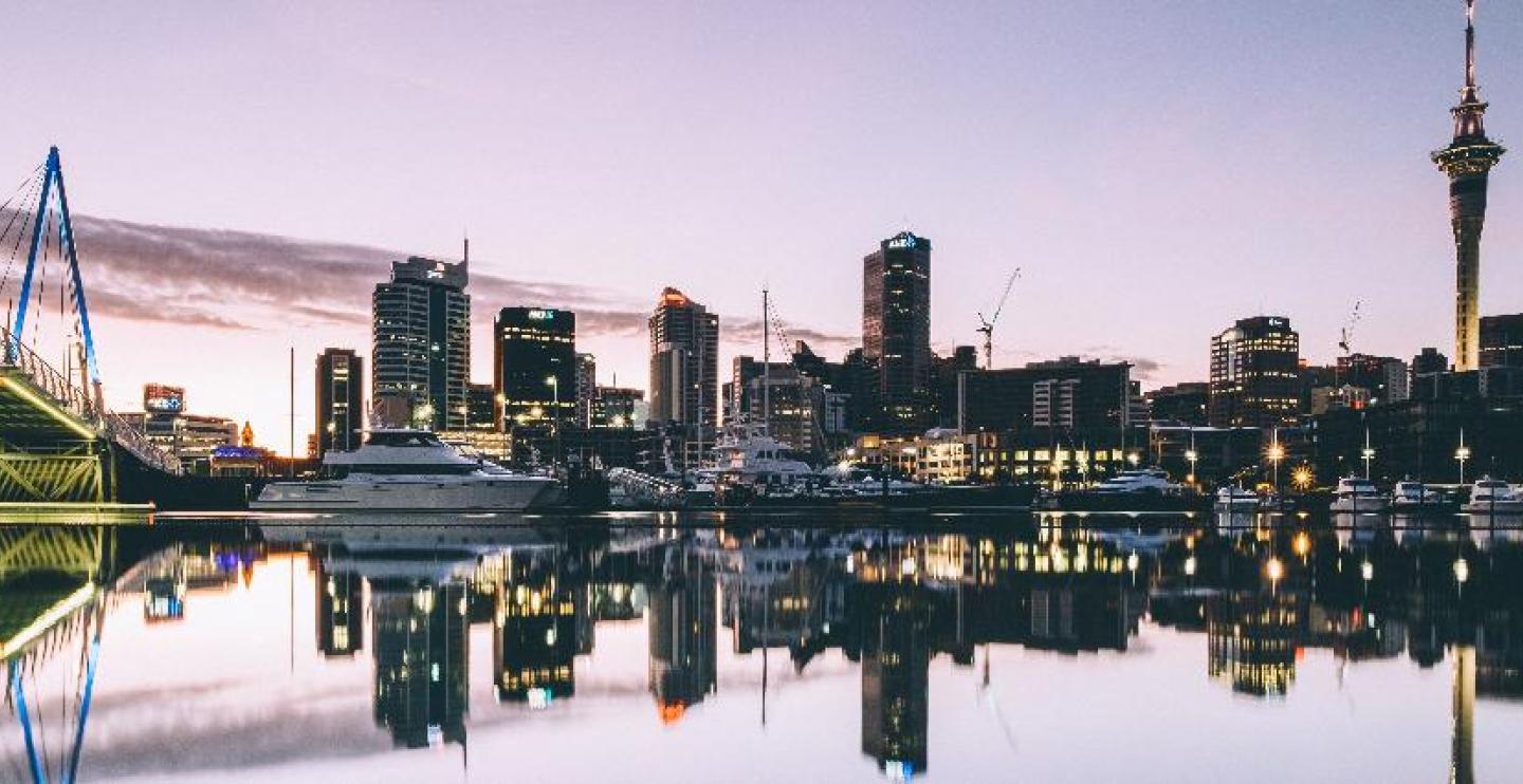 Skyline of Auckland with image of city reflecting in the water
