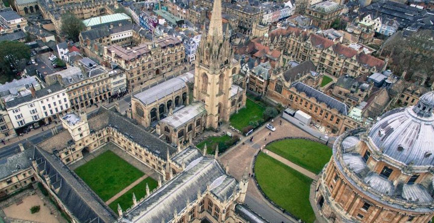 Aerial view of Oxford, ranging from old historic buildings and bright, lush yards of grass