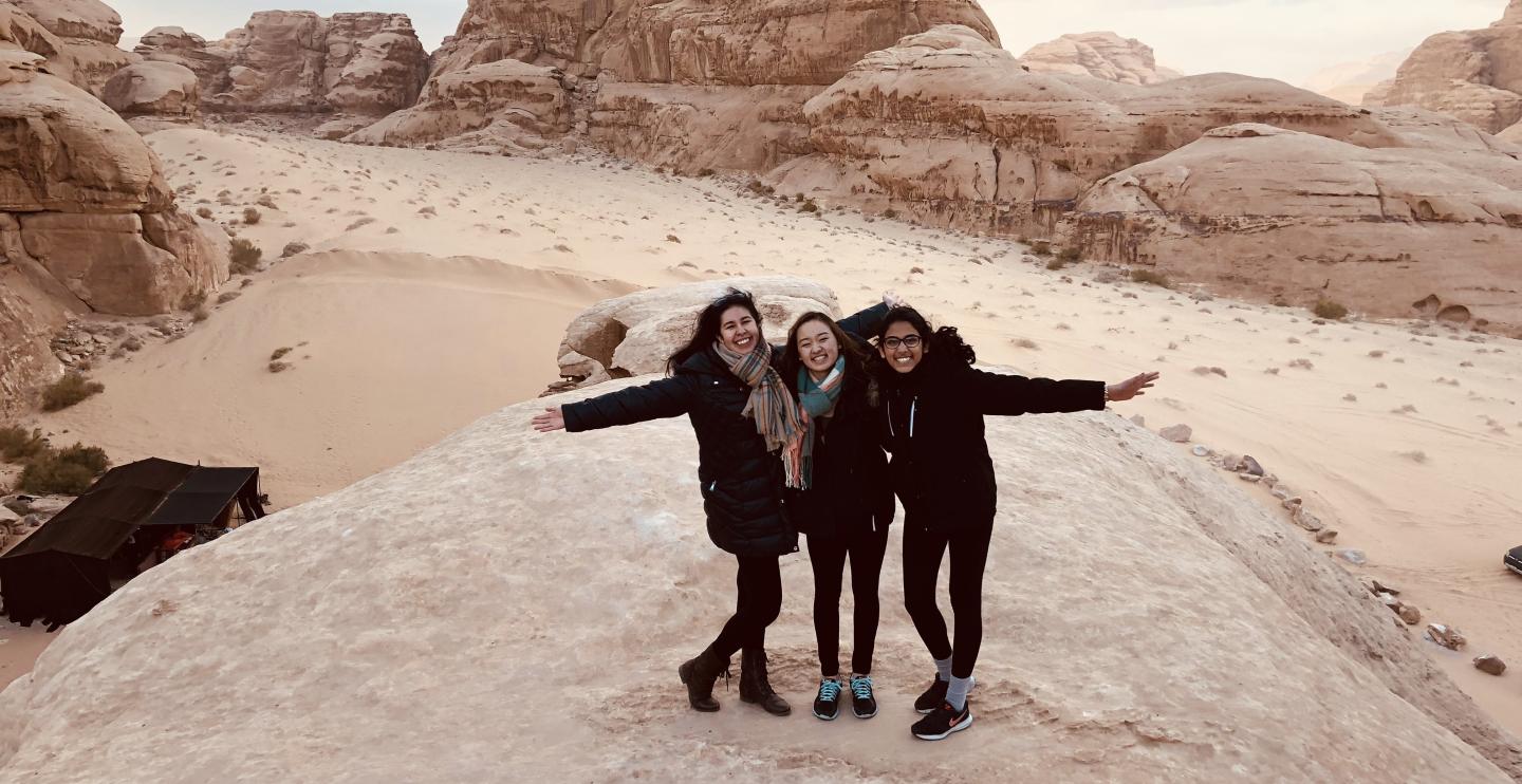 3 MIT students posing in Jordan, Israel
