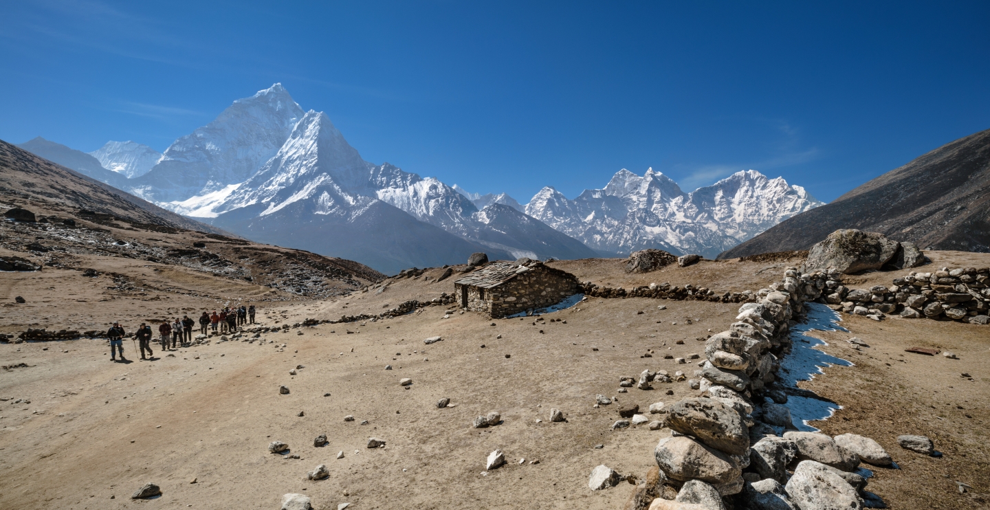 Scenic picture of Nepal mountains covered snow and a gravel path