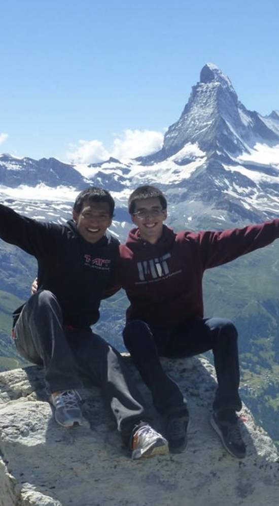 Two student interns on top of a mountain
