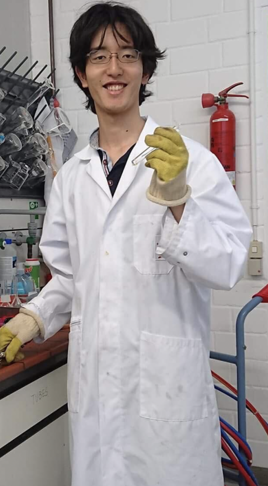Student intern Tomohiro Soejima in lab coat