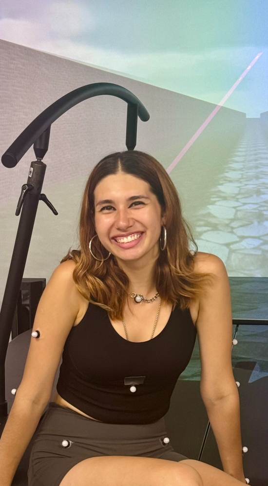 Alexandra Valdepenas Ramirez seated on a black mat with handles on both side