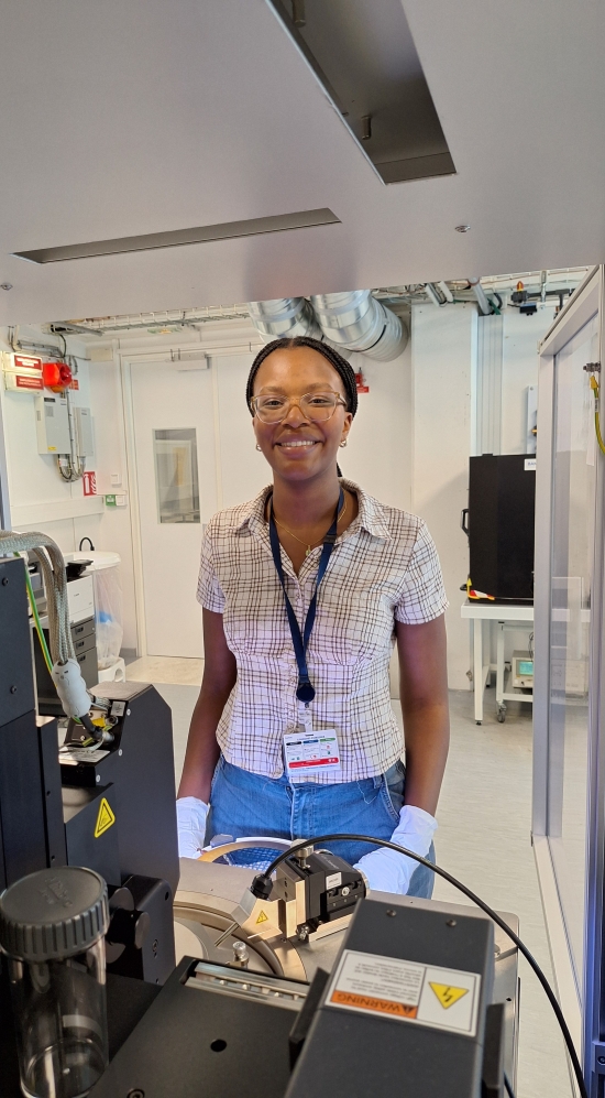 Zuri Vallery wearing a lanyard nametag in a lab