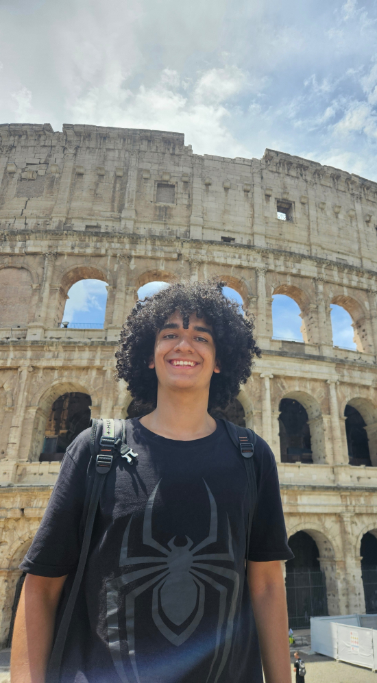 Gabriel Hemetrio standing in front the colosseum in Rome