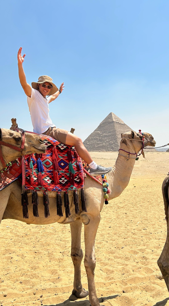 Jordan Tran riding a camel