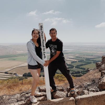 Student on top of mountain in Israel