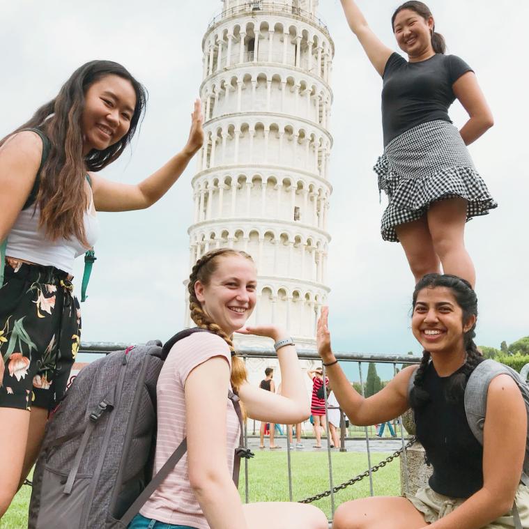 Students posing next to Tower of Pisa in Italy