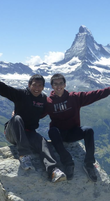 Two student interns on top of a mountain