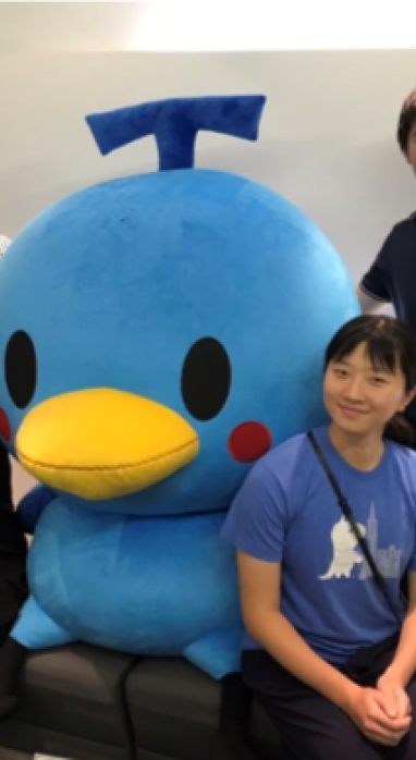 Christina with her co-workers and the Venture Republic mascot