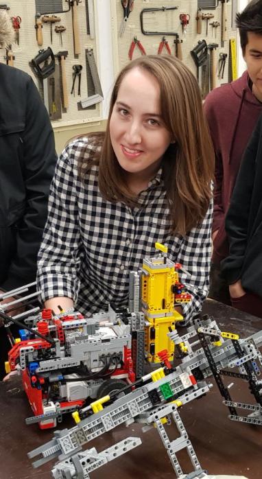 Emily Cimmino working on Lego Mindstorms with a group of students
