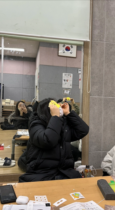 korean student looking through foldscope gtl korea misti