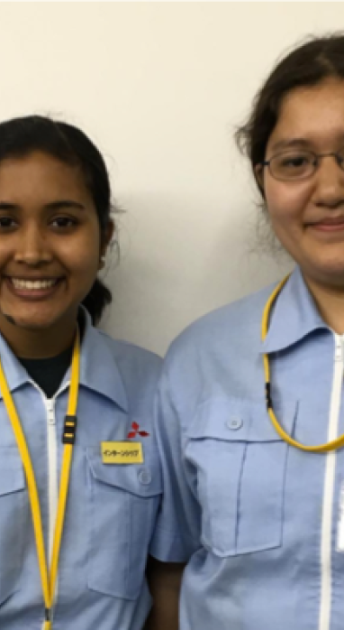 Ananda with her fellow intern in their company uniform