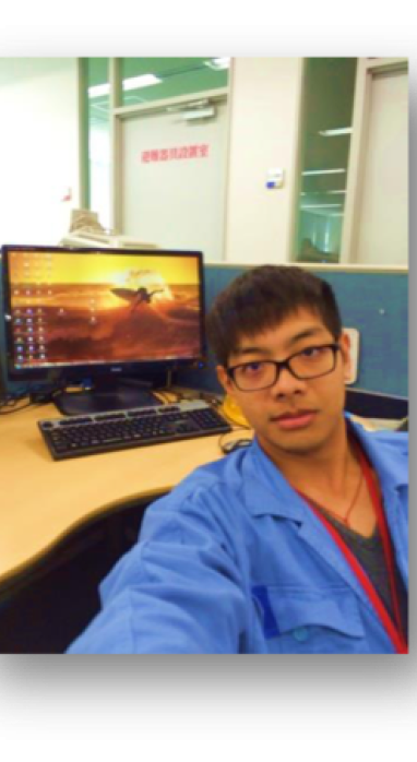 De Xin at his work desk