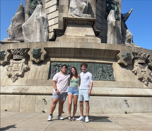 Santiago Vazquez pictured with two other MIT students in front of the Colon Statue in Spain