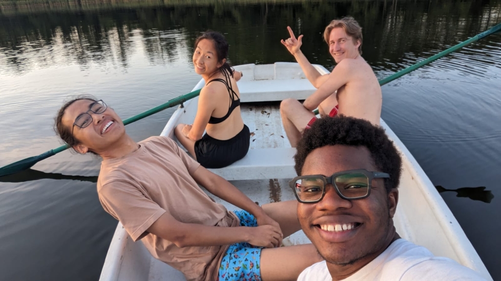 Dami Thomas and friends in a boat 