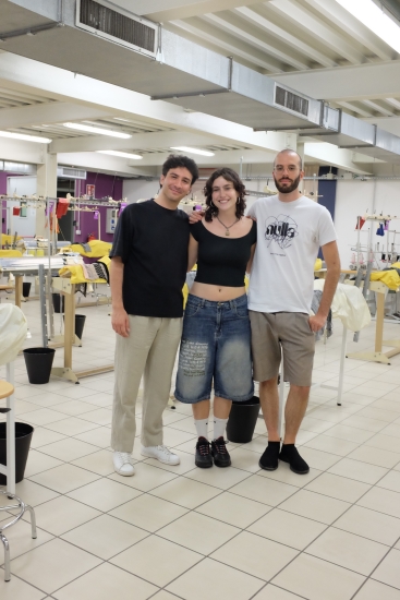 Layla Stanton standing in between her colleagues at Politecnico di Milano