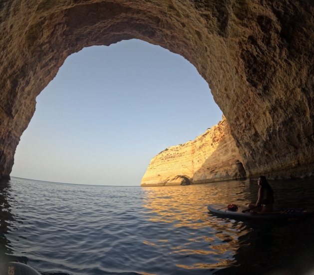 Chen Li on a paddleboard in a cove