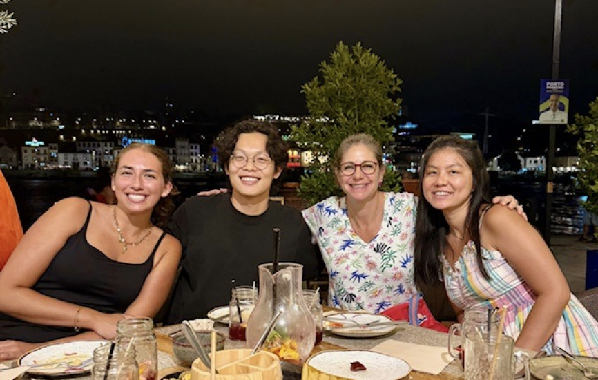 Sophia, Stephen, Alicia and Chen Li seated next to each other over dinner 